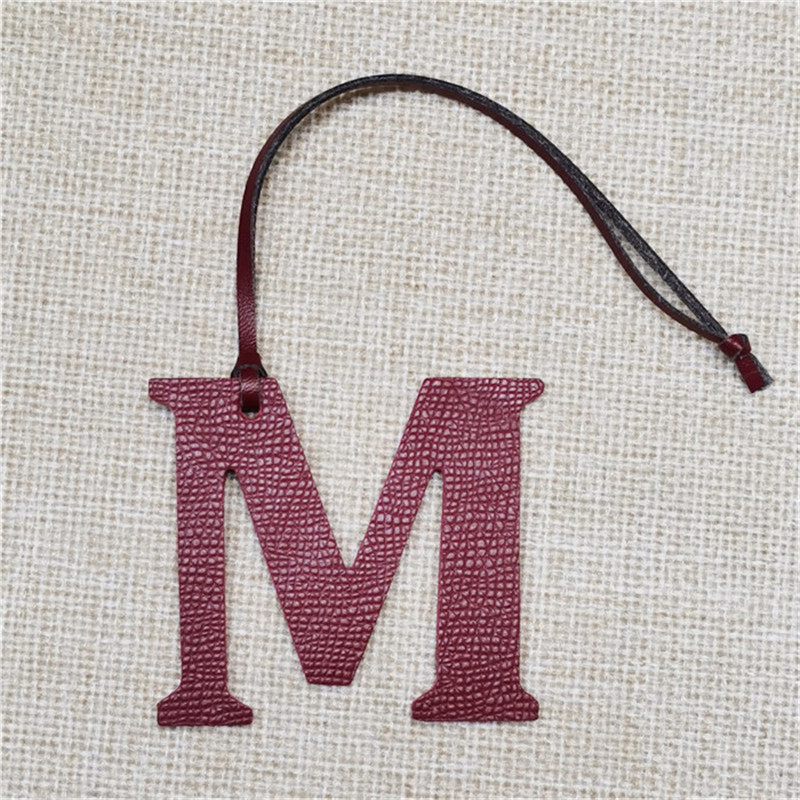 XMESSUN New English Letters M  - Monogram Keychain Leather recension och pris